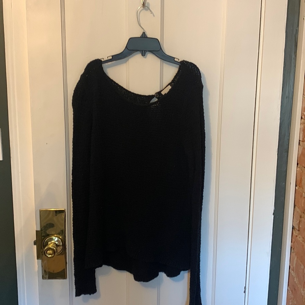 Black, loose fitting, sweater